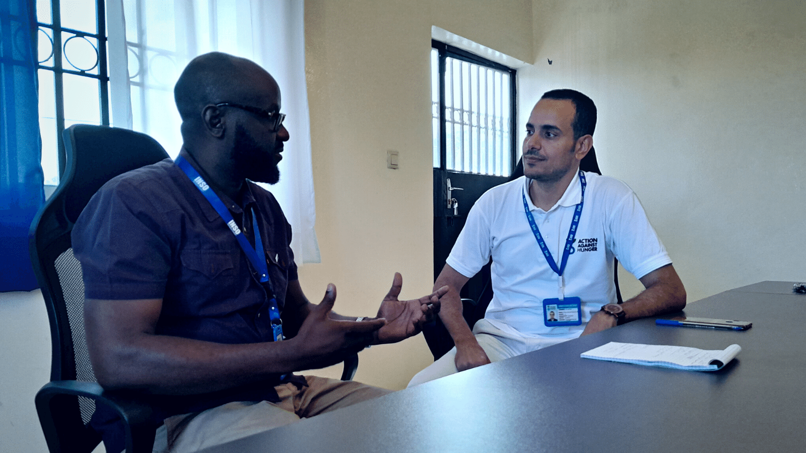 INSO Safety Advisor discussing with a staff member of an NGO