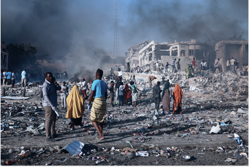CREDIT ICRC: Mogadishu, Hodan district. Civilians prepare to carry dead bodies of unidentified persons after an explosion.