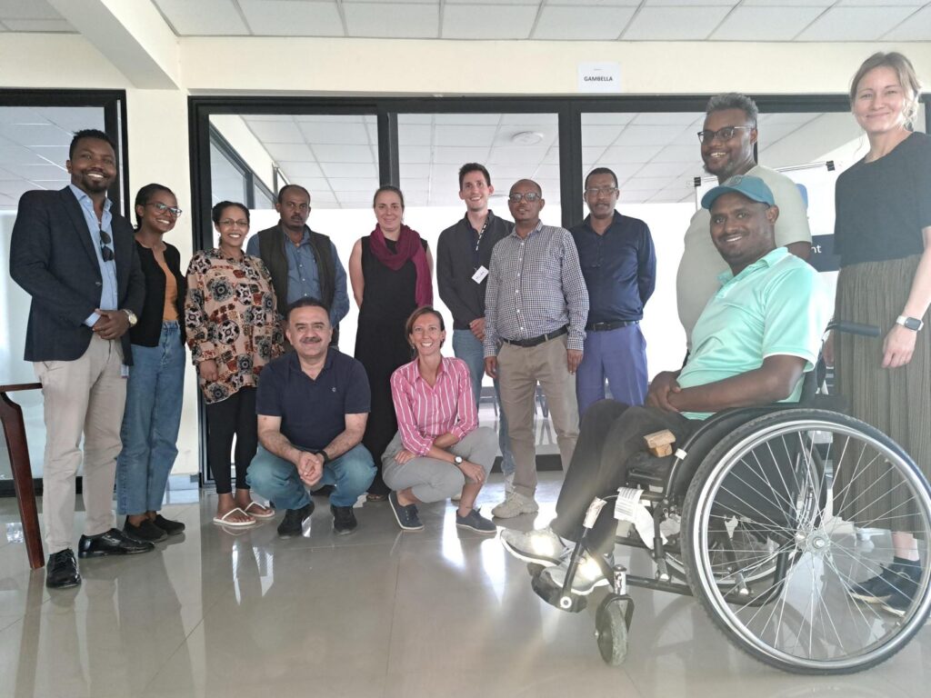 A group of training participants posing for a group picture